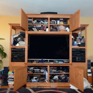 Unorganized & Cluttered Home Entertainment Center - Before Photo